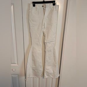 High waisted white flare denim jeans. Size Small.